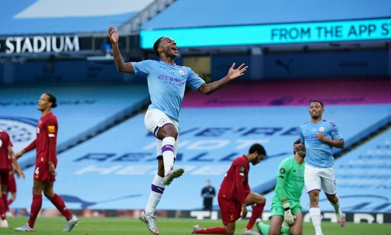 Raheem Sterling celebrates Manchester City's second goal against Liverpool