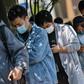 Workers wait in line to collect salaries in Shanghai