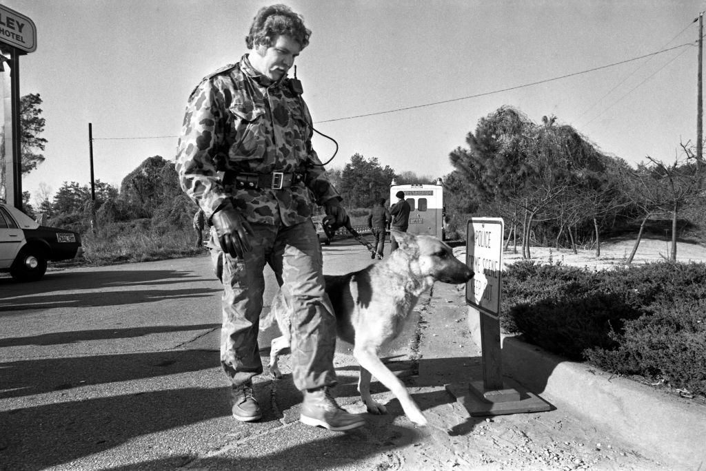 Members of the Atlanta Police SWAT team search the woods, 1981