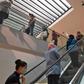 Shoppers wearing protective face masks  observe a safe distance at a clothing store in the Tunisian capital on May 12, 2020 following the easing of the lockdown measures put in place to combat the spread of coronavirus