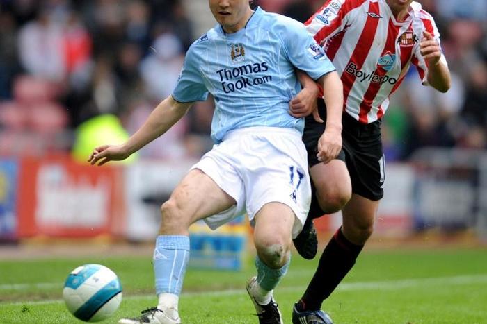 Sun Jihai (left) playing for Manchester City in 2008