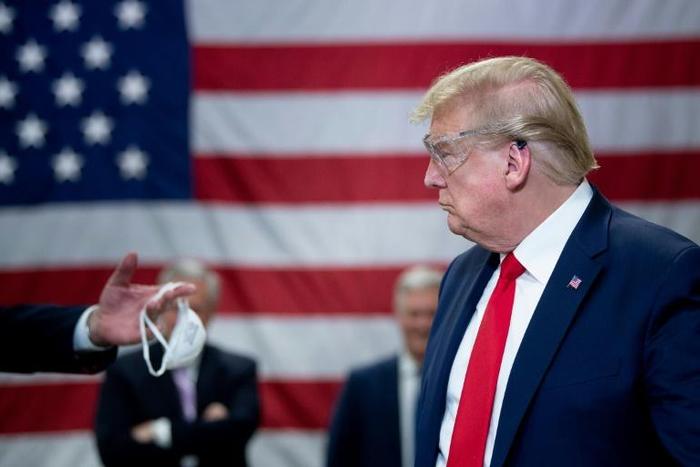 US President Donald Trump's government promotes masks to fight COVID-19 but he won't wear one himself