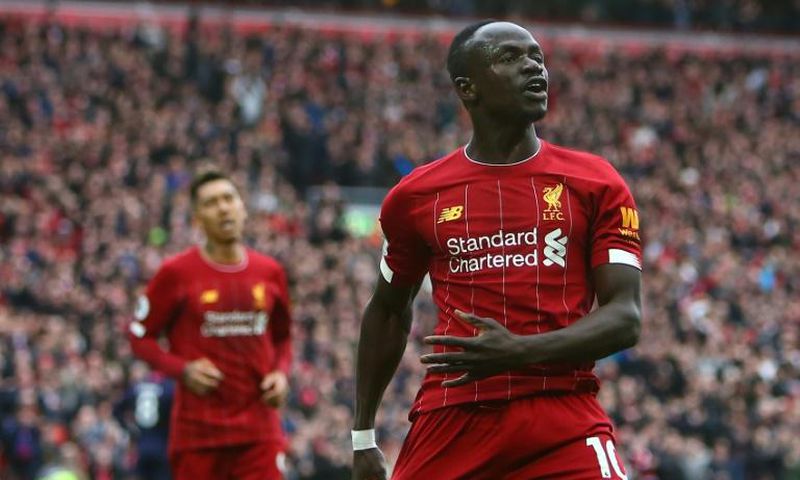 Liverpool's Senegalese striker Sadio Mane (R) has donated $50000 US dollars to the Coronavirus fight in gis country