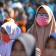 A woman wears a face mask in Banda Aceh, Indonesia on March 14, 2020