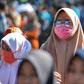 A woman wears a face mask in Banda Aceh, Indonesia on March 14, 2020