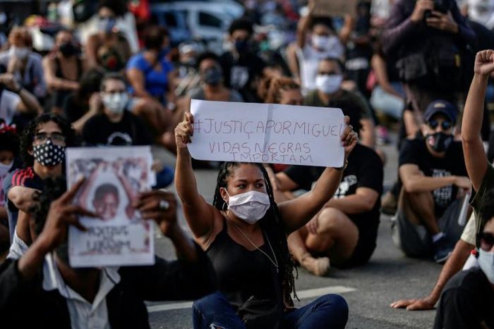 Protestors demand justice for the death of five-year-old Miguel da Silva, who fell from the ninth floor of a building while under the watch of his mother's white employer