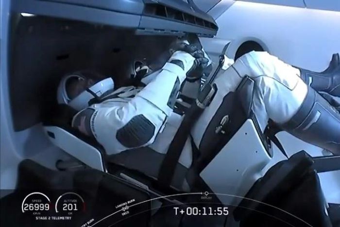 In this still image taken from NASA TV, NASA astronauts Bob Behnken (front) and Doug Hurley reach orbit on May 30, 2020, after launching from Kennedy Space Center in Florida