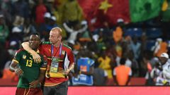 Midfielder Christian Bassogog (L) and assistant coach Sven Vandenbroeck celebrate after Cameroon won the 2017 Africa Cup of Nations final against Egypt in Libreville