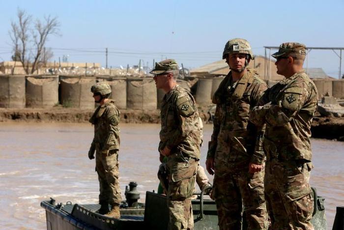 US army forces supervise during a training session at the Taji camp, north of Baghdad - the site of Wednesday night's rocket attack