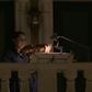 Members of Qatar's philharmonic orchestra perform from their balconies one last time before Ramadan in Qatar's Qanat Quartier, a part of Doha's man-made Pearl island