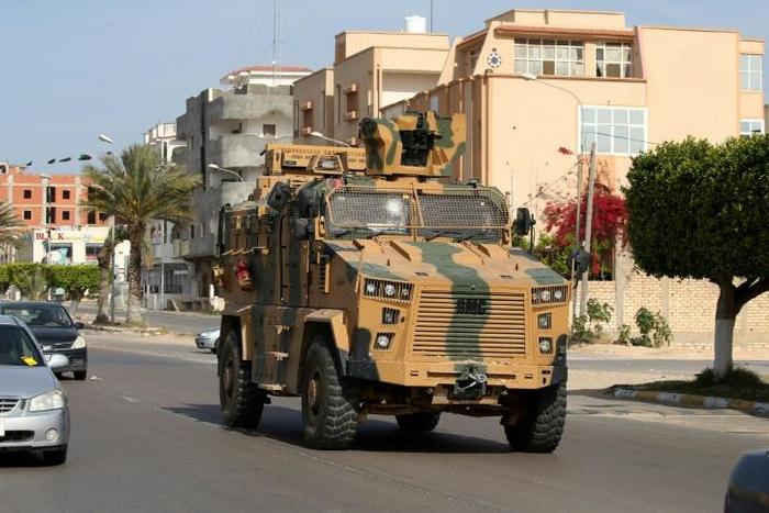 A file photo from June 2019 shows fighters loyal to the UN-recognised Government of National Accord (GNA) open tank fire south of the Libyan capital Tripoli during clashes with forces loyal to strongman Khalifa Haftar