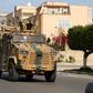 A file photo from June 2019 shows fighters loyal to the UN-recognised Government of National Accord (GNA) open tank fire south of the Libyan capital Tripoli during clashes with forces loyal to strongman Khalifa Haftar