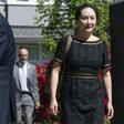 Meng Wanzhou, CFO of Huawei, walks down her driveway to her car as she departs her home for court on May 27, 2020 in Vancouver, Canada