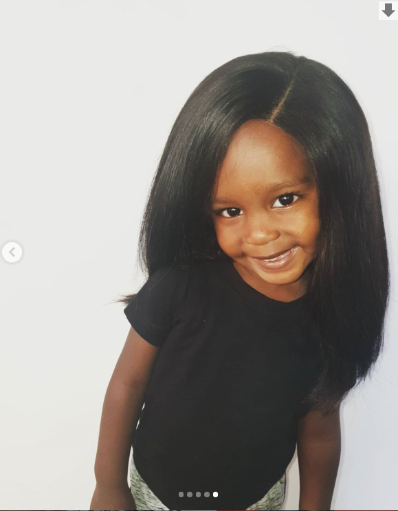 Njugush and Wakavinye's son in a wig (Instagram)