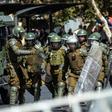 Chilean riot police take position during a protest against President Sebastian Pinera on the second anniversary of his inuguration in Santiago on March 11, 2020.