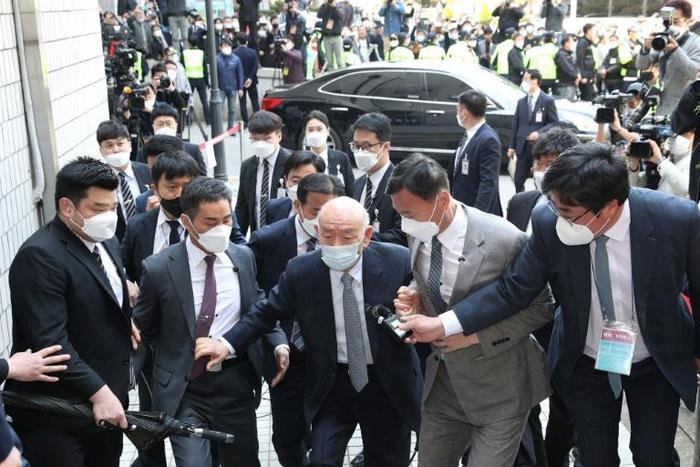 Former dictator Chun Doo-hwan (C) remains hugely divisive in South Korea