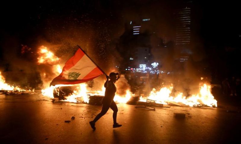 Lebanese protesters angered by a growing economic crisis set tyres on fire and blocked roads