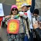 About 150 protesters rallied outside Victoria's state parliament to protest against a shutdown aimed at stemming the spread of COVID-19, while also peddling conspiracy theories about the virus