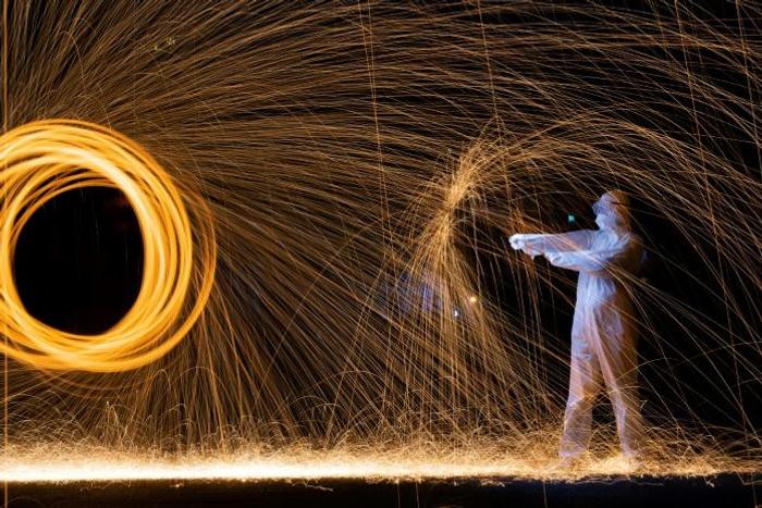 Beijing-based artist Roy Wang has paid tribute to doctors and nurses battling to treat virus patients in his latest light painting creations