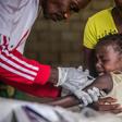 "Routine immunisation is absolutely critical always, but is particularly critical at a time like this because if other outbreaks occur, they will overwhelm the health system," a vaccine specialist says