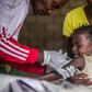 "Routine immunisation is absolutely critical always, but is particularly critical at a time like this because if other outbreaks occur, they will overwhelm the health system," a vaccine specialist says