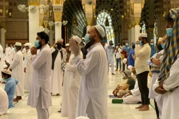 Worshippers pray at the Prophet's Mosque in the holy city of Medina after Saudi authorities allowed it to reopen at 40 percent capacity