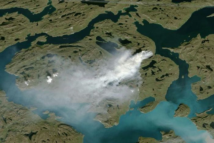 The risk of wildfires increases with warm, dry conditions(NOAA satellite photo showing cloud of smoke from wildfire in western Greenland)