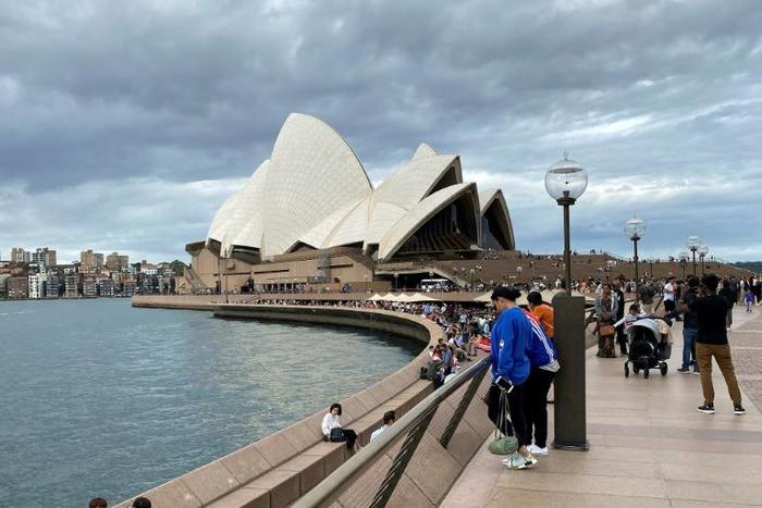 Some passengers on the Ruby Princess cruise ship were displaying flu-like symptoms when it berthed in Sydney Harbour