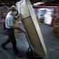 Employees at  coffin-maker OGF have little time to stand still as orders are up thanks to the coronavirus pandemic