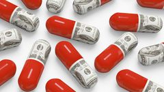 Pills decorated with dollar bills