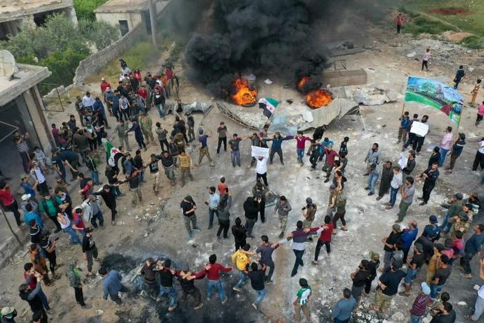 A drone images shows Syrian demonstrators gathering during a protest in the village of Maaret al-Naasan in Syria's Idlib province to protests against a reported attack by Hayat Tahrir al-Sham, an alliance led by a former Al-Qaeda affiliate