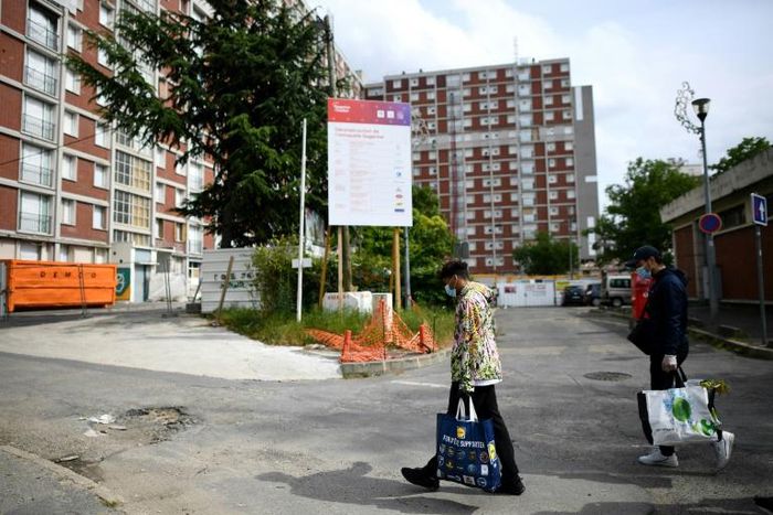 French professional handball player Walid Badi (C) used the time during lockdown to step up help for the needy via his Solidaritess association