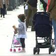 Children in Madrid enjoy the sunshine with their parents, as they are allowed outside on Sunday for the first time in six weeks