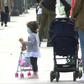 Children in Madrid enjoy the sunshine with their parents, as they are allowed outside on Sunday for the first time in six weeks