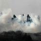 Young Palestinians brave Israeli tear gas to demonstrate against a rumoured land seizure near the northern West Bank city of Nablus