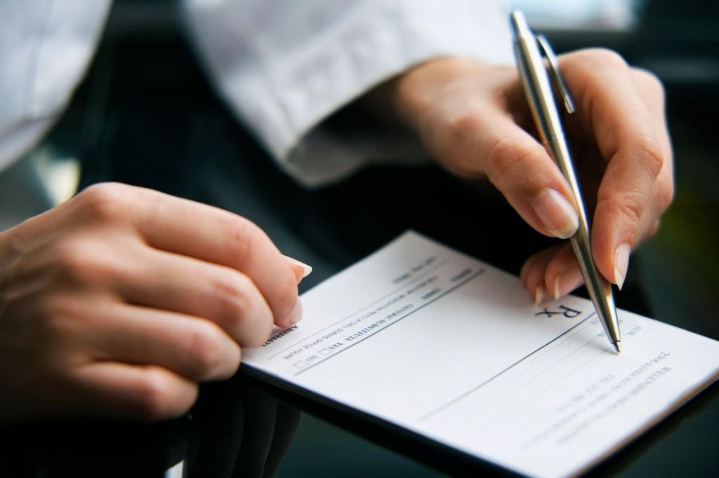 female doctor writing prescription