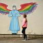 A girl looks at a mural by artist Rachel List paying tribute to NHS staff in Britain