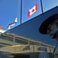 Flags of Nova Scotia and Canada fly at half-staff outside the Nova Scotia Royal Canadian Mounted Police (RCMP) headquarters in Dartmouth on April 19, 2020, after a shooting rampage left 22 dead