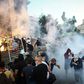 Clouds of tear gas and smoke filled central Belgrade after a peaceful gathering descended into tense confrontations between protesters and police