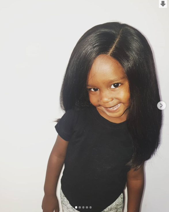 Njugush and Wakavinye's son in a wig (Instagram)