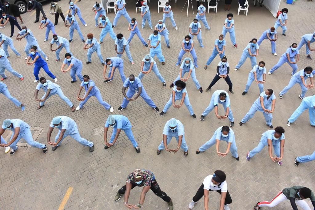 Nurses at the KNH Infectious Disease Unit during a Zumba workout on May 28, 2020 at the Mbagathi Hospital
