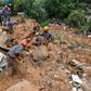 Rescuers search for victims at the Morro do Macaco Molhado favela in the coastal city of Guaruja, Sao Paulo, after it was struck by torrential rains
