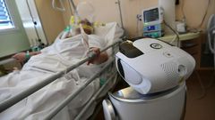 One of the six robots at the Circolo di Varese hospital in northern Italy checks up on a patient in the intensive care unit, helping medical staff reduce the risk of direct contact