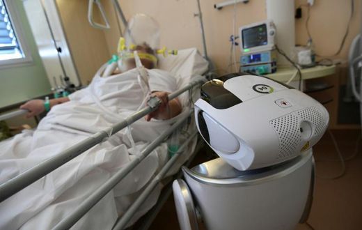 One of the six robots at the Circolo di Varese hospital in northern Italy checks up on a patient in the intensive care unit, helping medical staff reduce the risk of direct contact