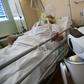 One of the six robots at the Circolo di Varese hospital in northern Italy checks up on a patient in the intensive care unit, helping medical staff reduce the risk of direct contact