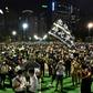 Tens of thousands of protesters defied a ban on public gatherings to hold a candlelight vigil to mark the 1989 Tiananmen Square crackdown