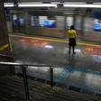 A woman stands at the Sumare subway station during the  COVID-19 pandemic in Sao Paulo, Brazil