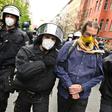 Police remove a demonstrator during he anti-confinement protest in Berlin