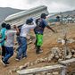 Relatives carry the coffin of a suspected COVID-19 victim in the outskirts of Lima, Peru