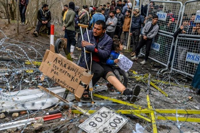 Greek officials accused Turkey of firing tear gas and smoke bombs at their border guards and providing cutters to migrants to break through fencing